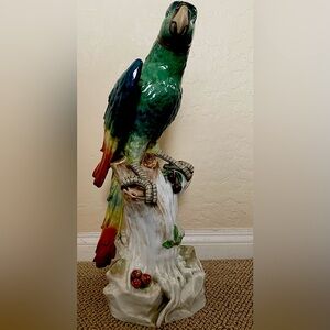 Standout vintage  porcelain green parrot hand decorated signed on the bottom.